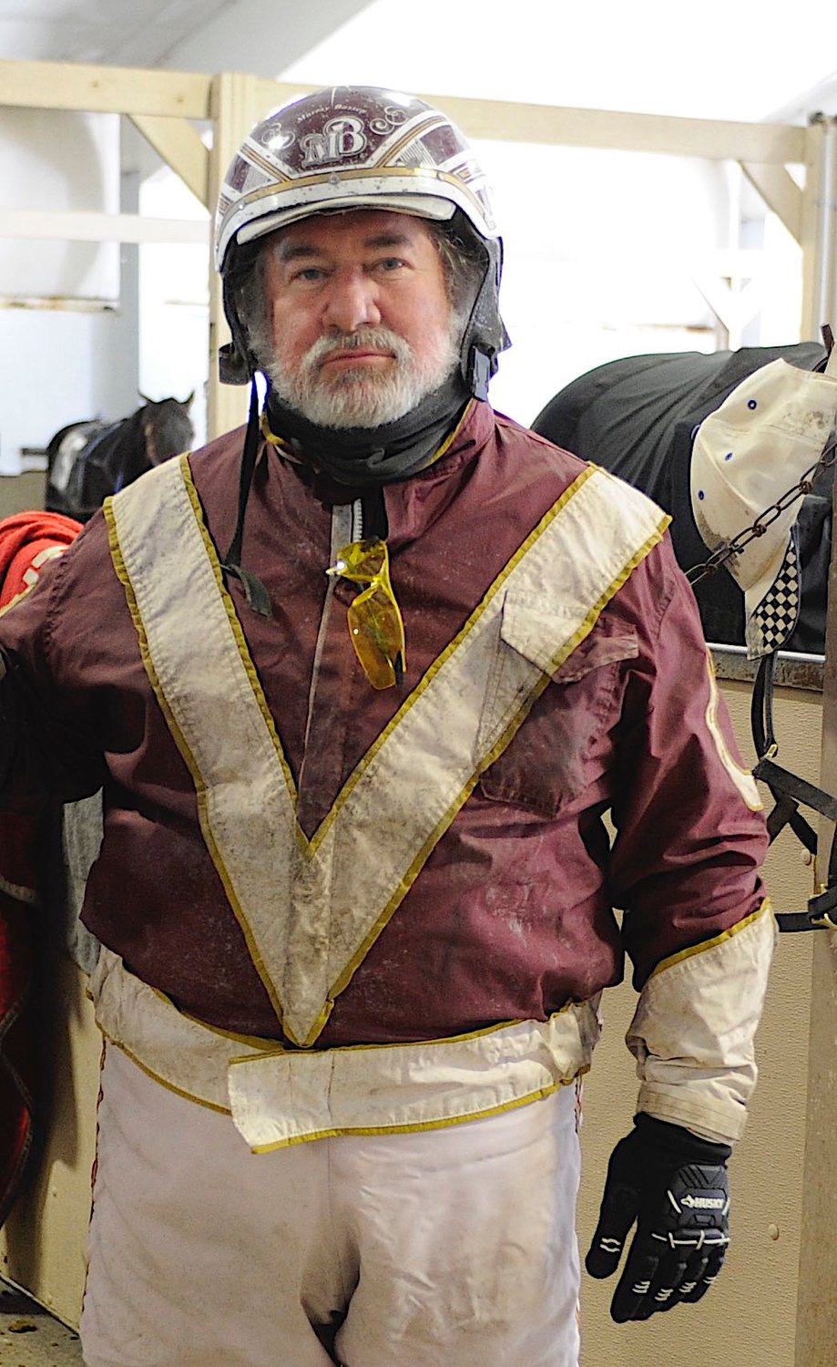 Veteran horseman Murray Bassen strikes a pose in the Monticello Raceway paddock in early January 2021.